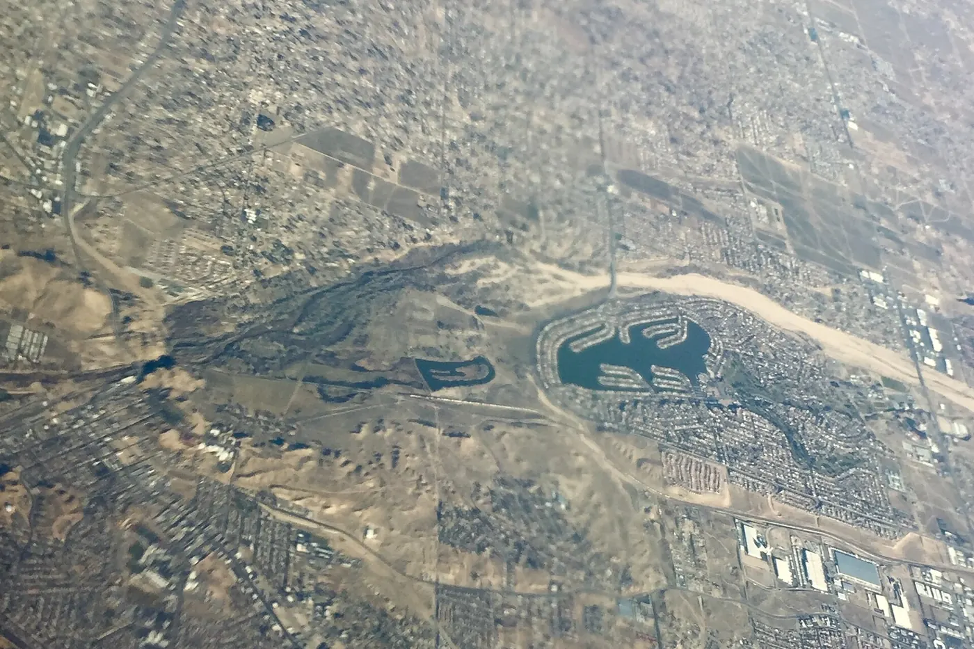 Aerial view over the Victor Valley and Mojave Narrows Regional Park along the Mojave River near Victorville, with Apple Valley beyond